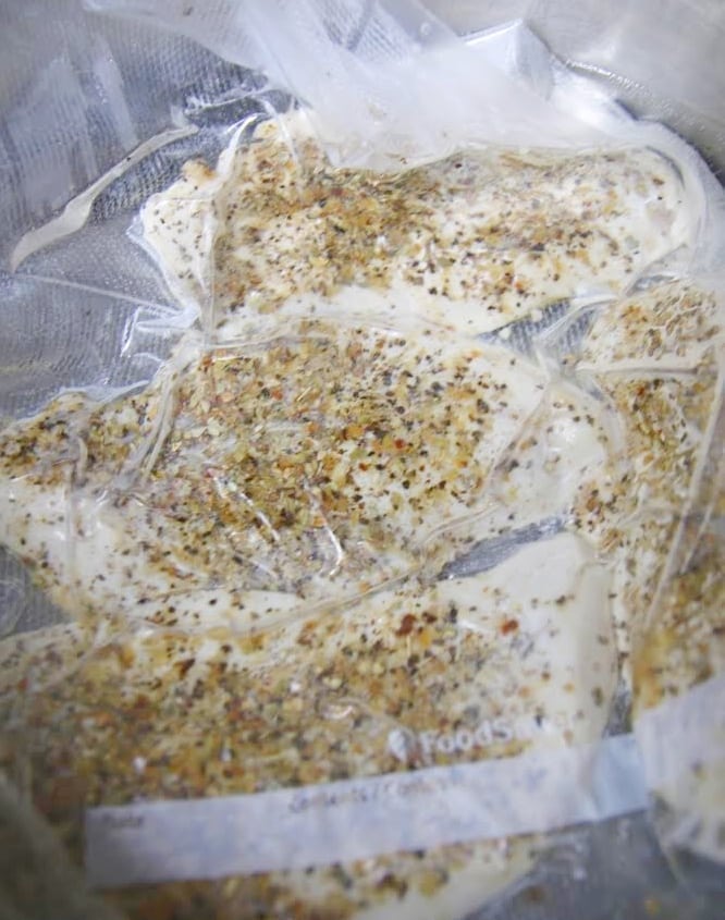 Sous-vide chicken breast cooking in bag